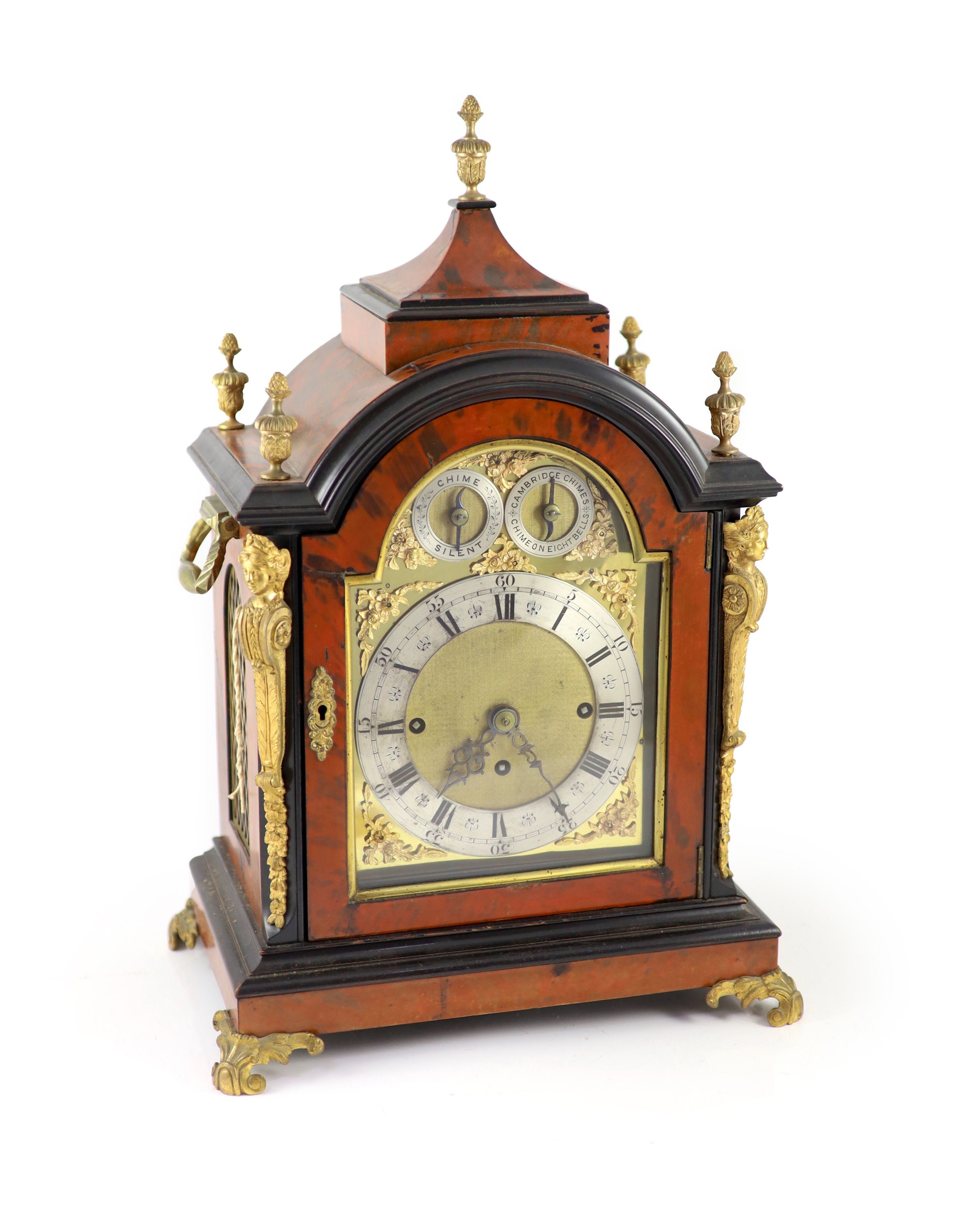 A late Victorian faux tortoiseshell and ebonised mantel clock 48cm high, 35 x 21cm